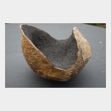 carved wooden sculpture with magnetite